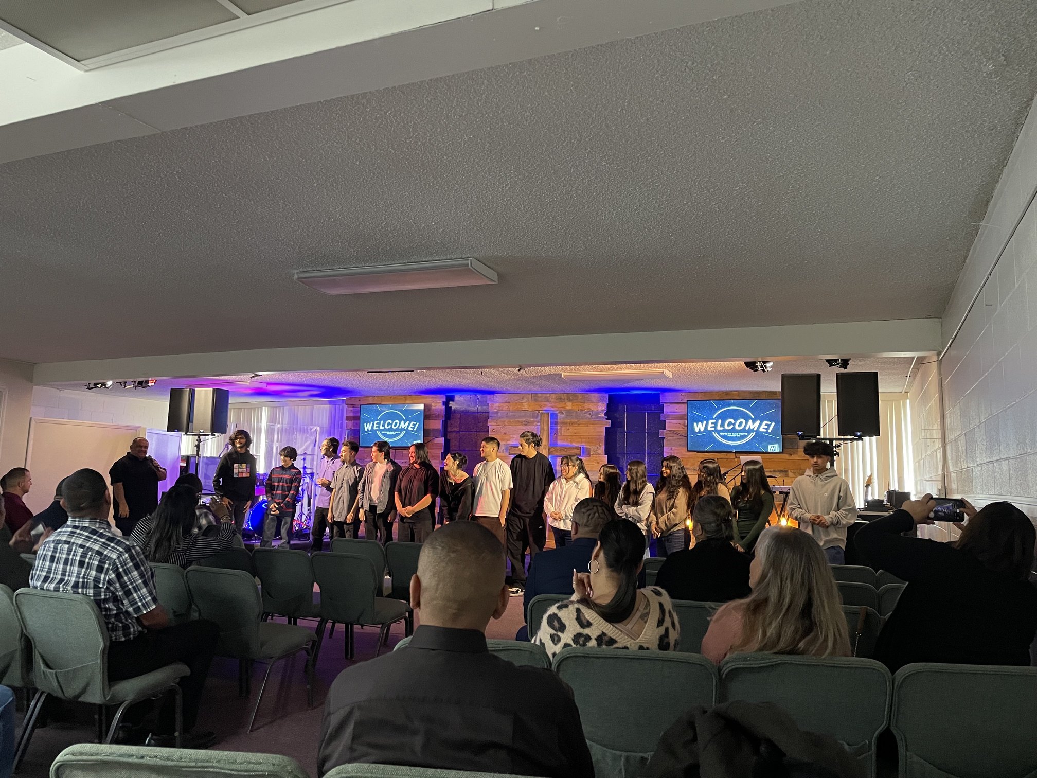 The Living Word of Upland congregation and stage team during a welcome moment in service